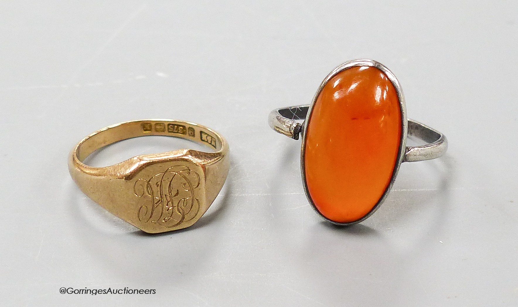 A 1930's 9ct. gold signet ring, size K, 3.1 grams and one other ring.